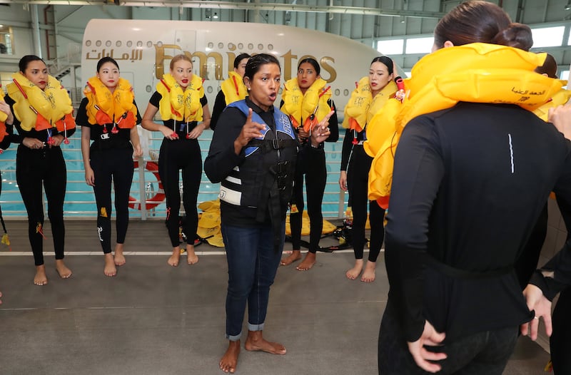 Tania Hettiaratchy lectures trainees on how to wear the life jackets for an emergency evacuation on water.