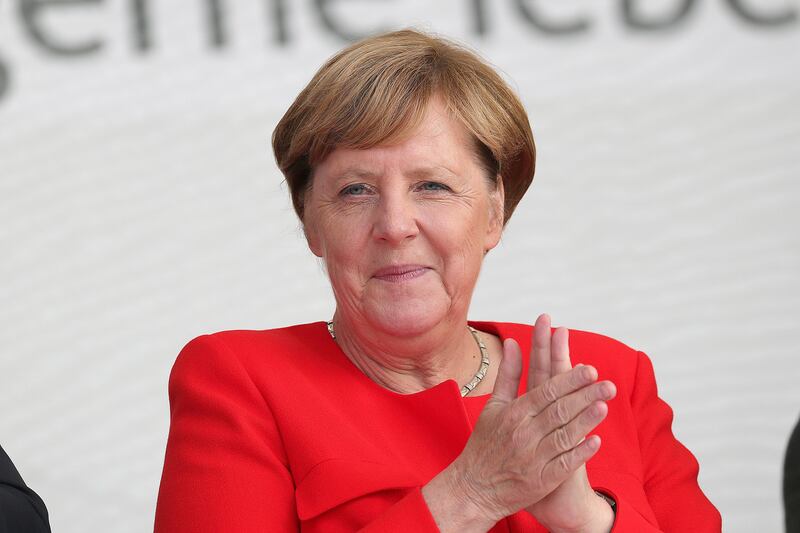 Angela Merkel, Germany's chancellor and Christian Democratic Union (CDU) leader, applauds during an election campaign stop in Saint Peter-Ording, Germany, on Monday, Aug. 21, 2017. Merkel headed out on the campaign trail last week and quickly faced disruption by anti-immigration demonstrators, a reminder that the refugee crisis that sent her popularity plunging in 2016 remains a residual risk. Photographer: Krisztian Bocsi/Bloomberg
