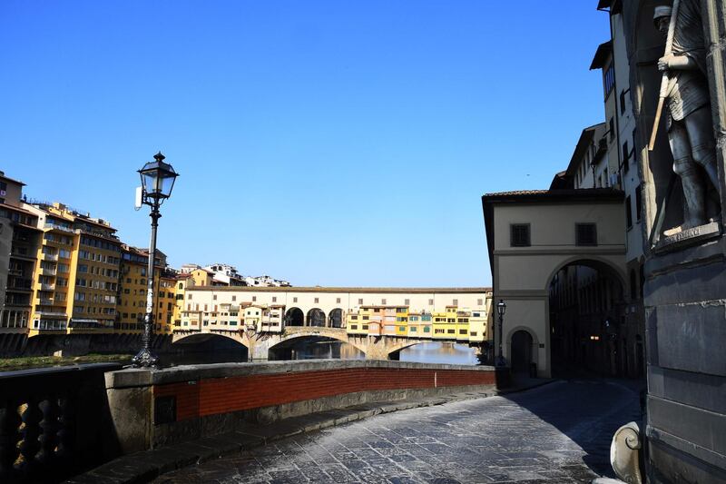The empty street facing the Ponte Vecchio in Florence during a strict lockdown put in place by Italian government to fight against the spread of the COVID-19. AFP