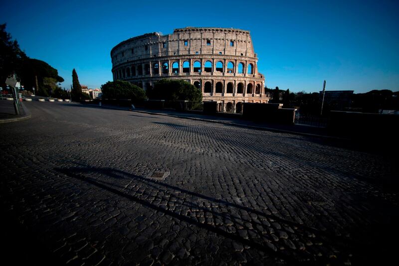 Rome's Colosseum looks abandoned without a tourist in sight. AFP