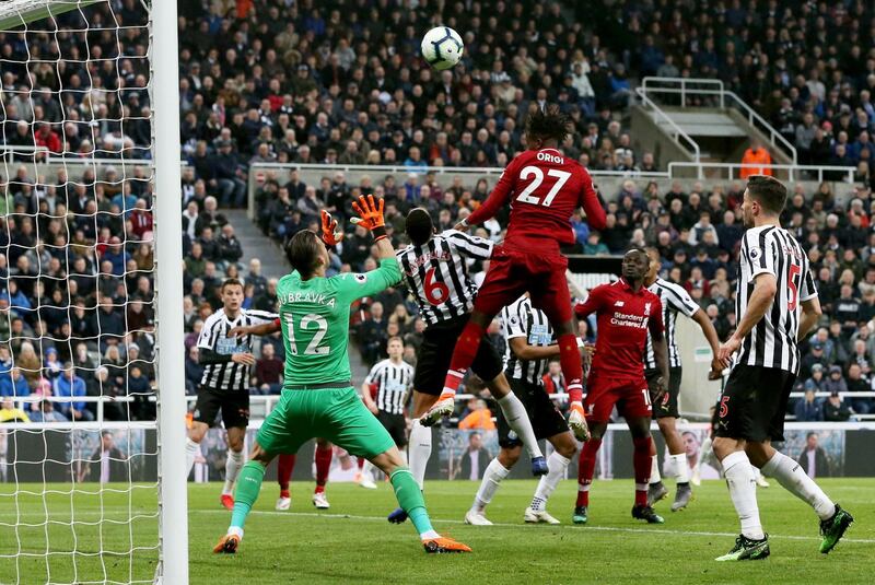 epa07547618 Liverpool's  Divock Origi (C) scores the 3-2 lead during the English Premier League soccer match between Newcastle United and Liverpool FC at St James' Park in Newcastle, Britain, 04 May 2019.  EPA/NIGEL RODDIS EDITORIAL USE ONLY. No use with unauthorized audio, video, data, fixture lists, club/league logos or 'live' services. Online in-match use limited to 120 images, no video emulation. No use in betting, games or single club/league/player publications