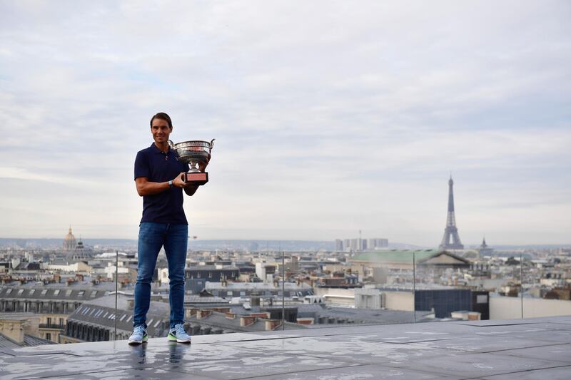 Rafael Nadal of Spain poses with his trophy on the rooftop of the Galerie Lafayette department store. EPA