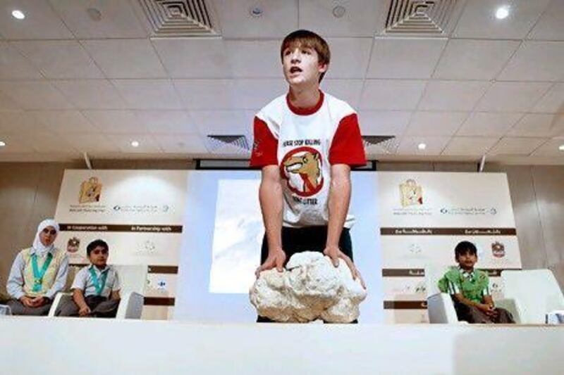 Cameron Oliver holds 10kg of calcified plastic bags extracted from a camel's stomach. His public service campaign to prevent littering and the subsequent killing of camels helped him become the first child to win the prestigious Abu Dhabi Award.