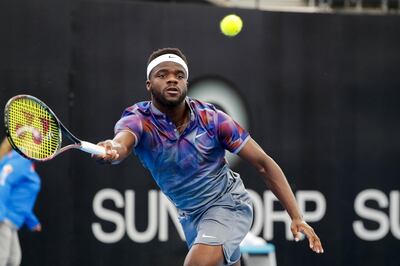 epa06412154 Frances Tiafoe of the USA in action against Matthew Ebden of Australia during their first round match at the Brisbane International Tennis tournament in Brisbane, Queensland, Australia, 01 January 2018.  EPA/GLENN HUNT EDITORIAL USE ONLY AUSTRALIA AND NEW ZEALAND OUT