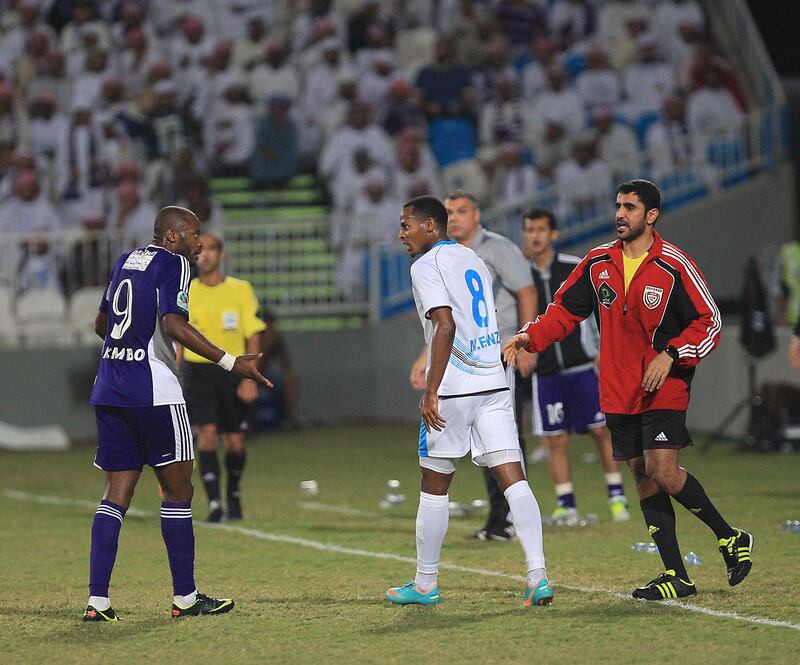 ABU DHABI - UNITED ARAB EMIRATES - 05DEC2012 - Al Ain’s Jires Kembo-Ekoko (L) and Baniyas’s Mohammed Fawzi reacts between the match, during the Etisalt pro-league match in Baniyas Studium. Ravindranath K / The National