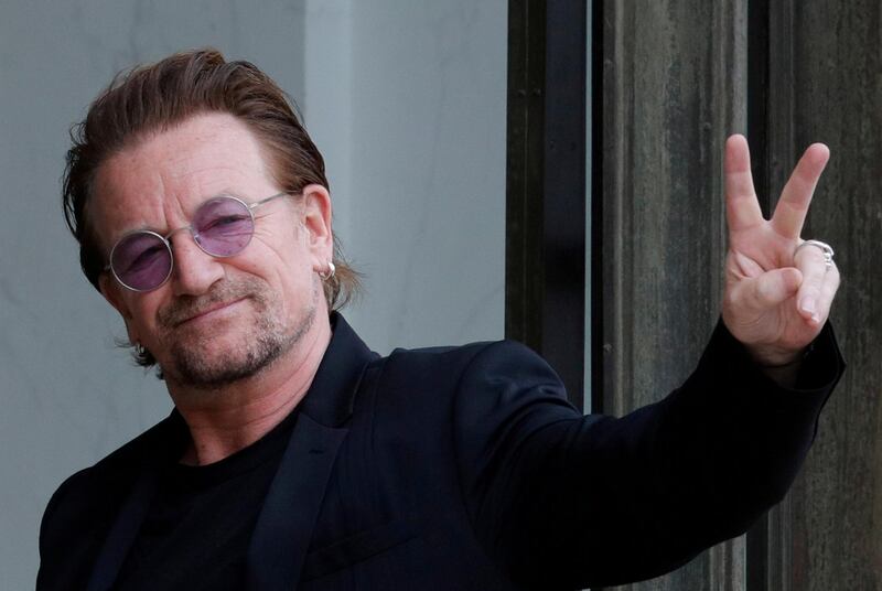FILE PHOTO: Singer Bono of Irish band U2 and co-founder of ONE organization waves as he arrives at the Elysee Palace in Paris, France, July 24, 2017.     REUTERS/Philippe Wojazer/File Photo