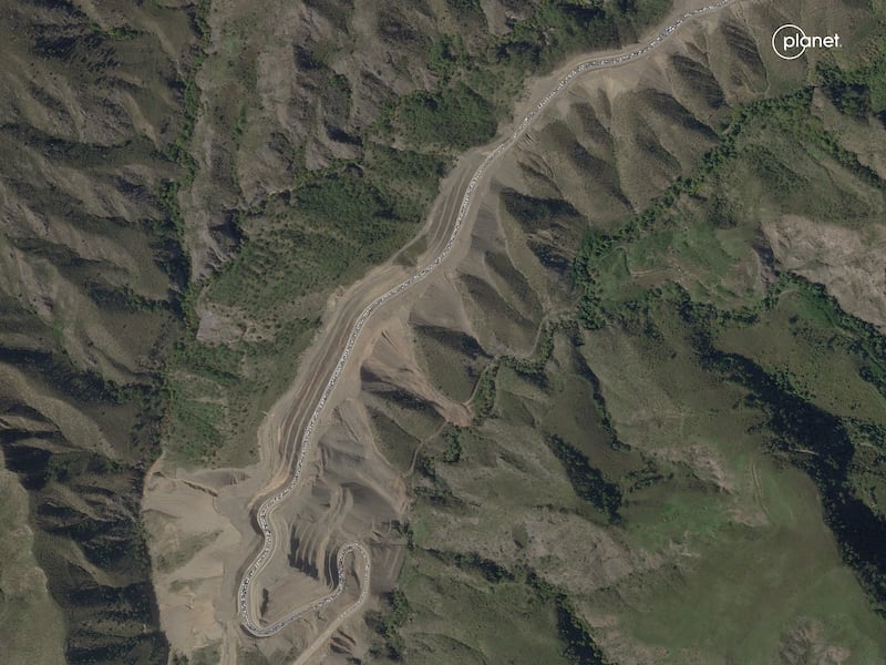 A satellite view of a long traffic jam of vehicles along the highway approaching to the Armenian border with Azerbaijan, at the Lachin corridor in the Nagorno-Karabakh region. AP