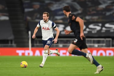 Tottenham's Harry Kane, left, runs with the ball during the English Premier League soccer match between Tottenham Hotspur and Manchester City at Tottenham Hotspur Stadium in London, England, Saturday, Nov. 21, 2020. (Neil Hall/Pool via AP)
