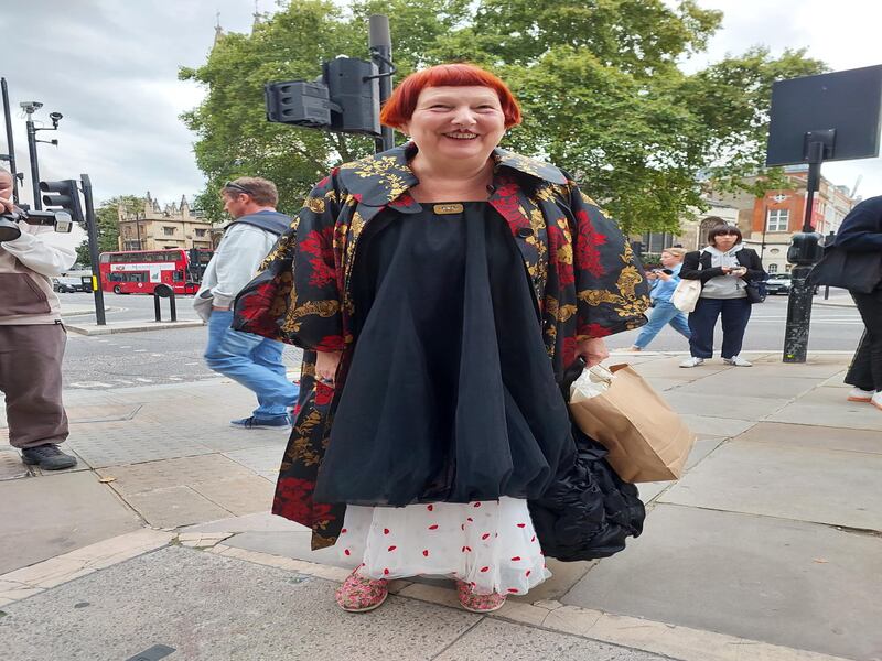 A woman wears several layers to London Fashion Week. 