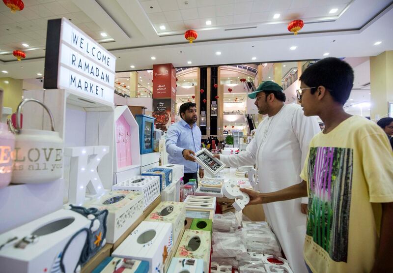 DUBAI, UNITED ARAB EMIRATES, 04 May 2018 - Shoppers checking out items at Ramadan Market, Dragon Mart 2.  Leslie Pableo for The National for Ellen Fortini's story