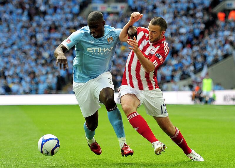 LONDON, ENGLAND - MAY 14: Micah Richards (L) of Manchester City holds off Marc Wilson (R) of Stoke City during the FA Cup sponsored by E.ON Final match between Manchester City and Stoke City at Wembley Stadium on May 14, 2011 in London, England. (Photo by Shaun Botterill/Getty Images)