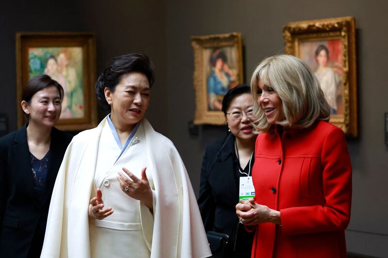 Ms Peng and Ms Macron inside the Orsay Museum. AFP