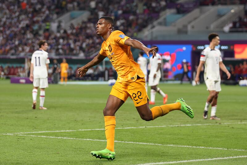 Denzel Dumfries celebrates after scoring. Getty