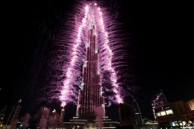 Dubai, United Arab Emirates, November 27, 2013:       Fireworks explode from the Burj Khalifa after Dubai was named the host city for Expo 2020 at Emaar Square in Dubai on November 27, 2013. Christopher Pike / The NationalReporter: N/ASection: News *** Local Caption ***  CP1127-expo-react-1-015.JPG
