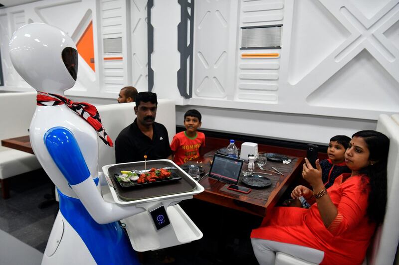 A service robot delivers food to customers at Robot restaurant in Bangalore, India. AFP