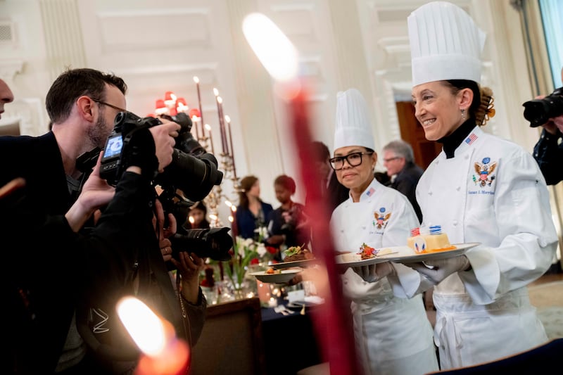Ms Comerford, second right, with White House executive pastry chef Susie Morrison. AP
