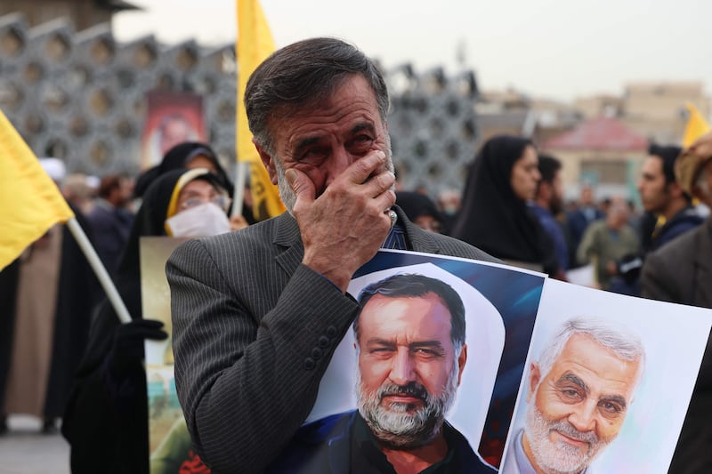 A man at the funeral in Tehran mourns Mousavi's death. AFP
