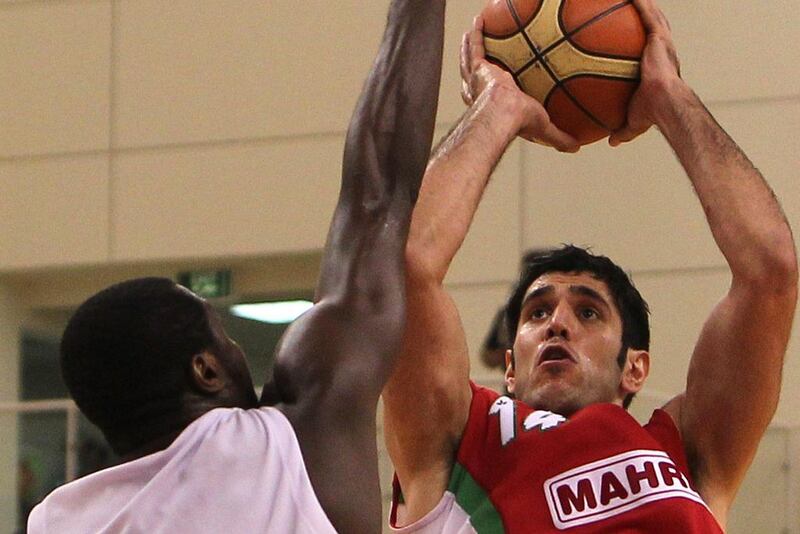 Mohammed Nikkah Bahrami shown with his club team, Mahram, in a Fiba Asia Champions Cup match against Qatar's Al Rayyan in 2010. AFP Photo / May 30, 2010