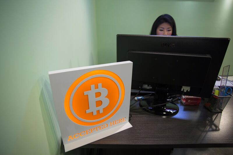 epa06360974 (FILE) - A Bitcoin sign is displayed in the lobby of the ANX office headquarters in Hong Kong, China, 13 March 2014 (reissued 01 December 2017). Finance experts have warned of a possible Bitcoin bubble after the cryptocurrency had reached an all-time high exchange rate on 29 November, following a massive gain over the past weeks.  EPA/JEROME FAVRE