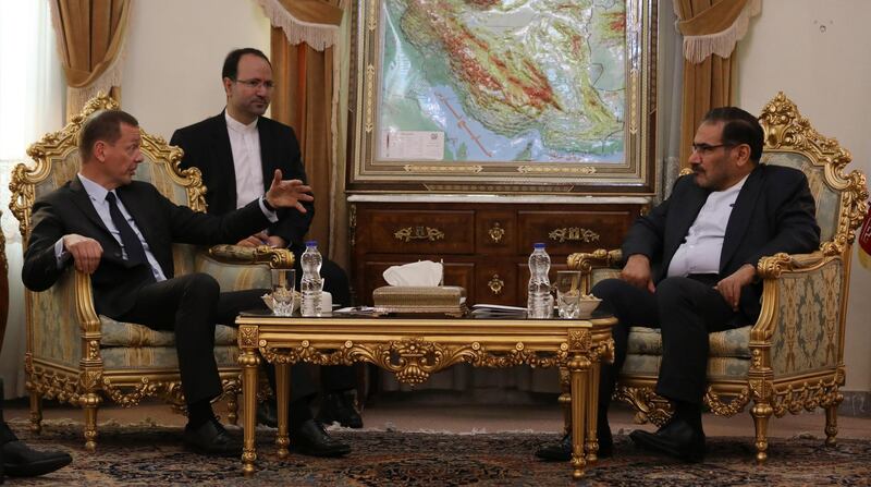 French presidential envoy Emmanuel Bonne, left, talks with Secretary of Iran's Supreme National Security Council Ali Shamkhani during their meeting in Tehran, Iran. AP Photo