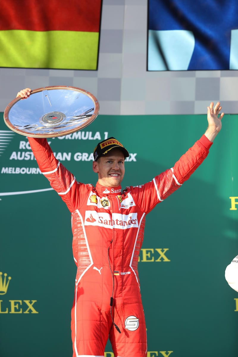 MELBOURNE, AUSTRALIA - MARCH 26:  Sebastian Vettel of Germany and Ferrari celebrates his win on the podium during the Australian Formula One Grand Prix at Albert Park on March 26, 2017 in Melbourne, Australia.  (Photo by Robert Cianflone/Getty Images)