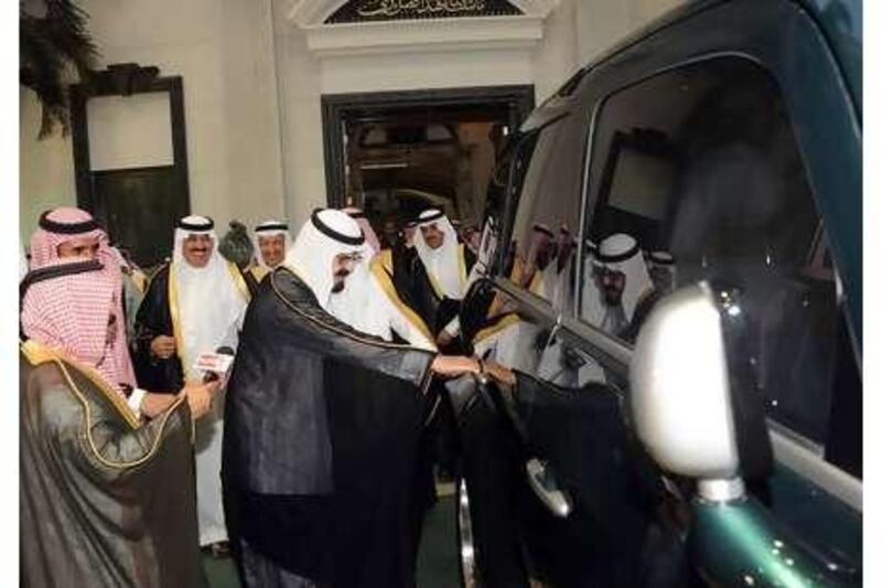 Saudi Arabia's King Abdullah looks over a prototype of the Ghazal. The SUV could help the country diversify its economy.