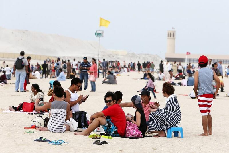 People were out in numbers on Jumeirah Open Beach in Dubai on Christmas Day. Pawan Singh / The National 
