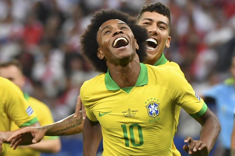 Brazil substitute Willian celebrates after scoring against Peru. AFP