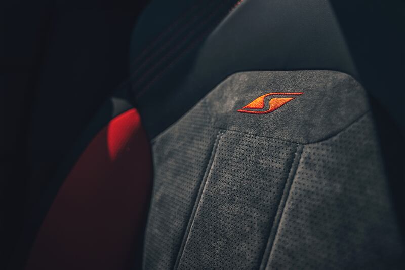 The S insignia on the Alcantara seating.