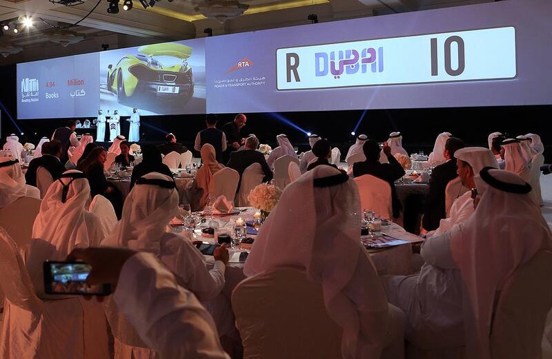 Bidders for the ‘R Dubai 10’ licence plate during the Emirates auction event at the Madinat Jumeirah in Dubai. Proceeds of the auction will go to the Reading Nation campaign. Satish Kumar / The National