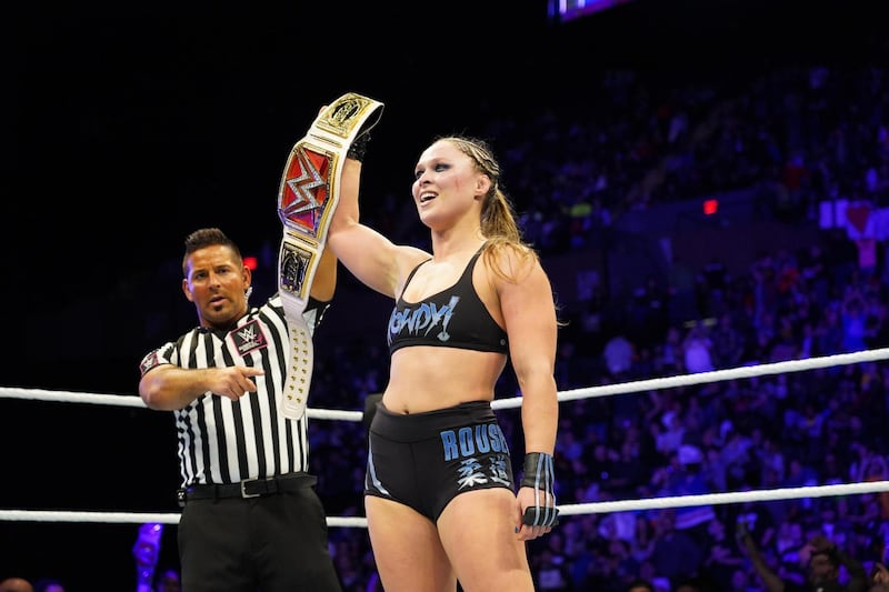 Ronda Rousey celebrates retaining her Raw Women's title at WWE Evolution. Courtesy WWE