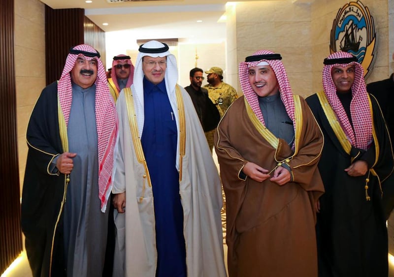 Kuwaiti Foreign Minister Ahmed Nasser Al Mohamed walking alongside Oil Minister Khaled Al Fadhel and Saudi Oil Minister Prince Abdulaziz bin Salmanat the Kuwaiti Foreign Ministry headquarters in Kuwait City. AFP