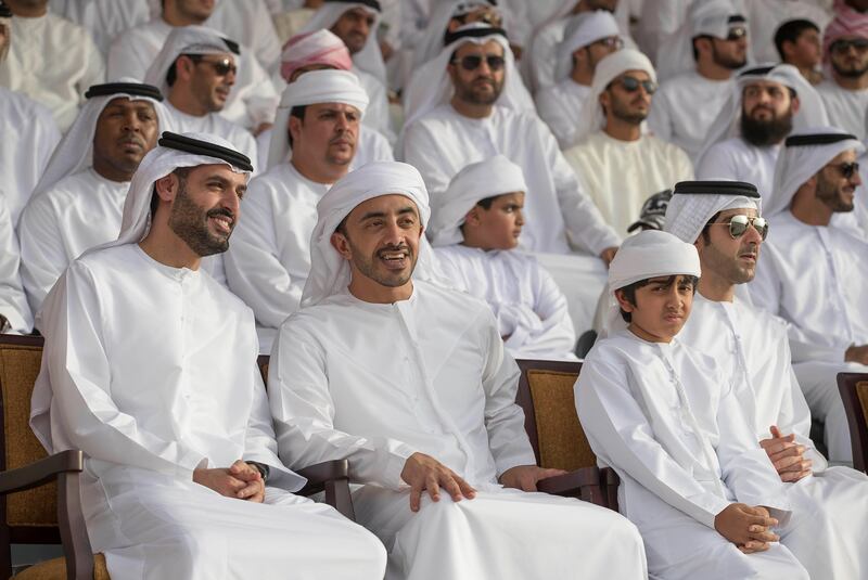Sheikh Mohammed bin Hamad (L), Sheikh Abdullah bin Zayed, Minister of Foreign Affairs and International Cooperation and Sheikh Hazza bin Tahnoon, Under-Secretary to the Ruler's Representative of the Eastern Region (R), watch an exercise during the volunteer cadet summer course graduation ceremony at Sieh Al Hama military camp. Mohammed Al Hammadi / Crown Prince Court - Abu Dhabi 