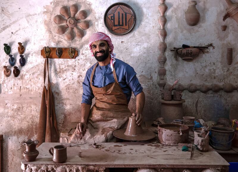 Craftsmen at Abu Dhabi's Heritage Village, including Egyptian potter Osama El Adel, use traditional methods to keep the art alive. All photos: Victor Besa / The National