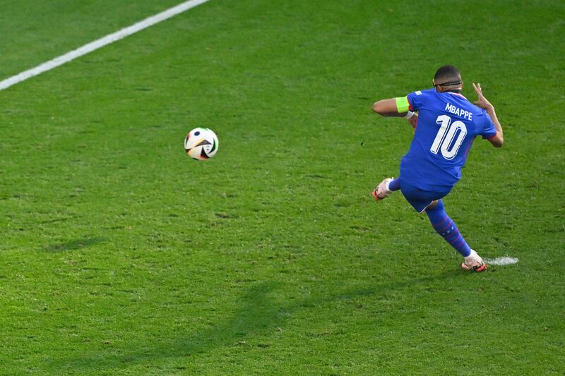 France's Kylian Mbappe scores from the penalty spot to put his side 1-0 up. AFP