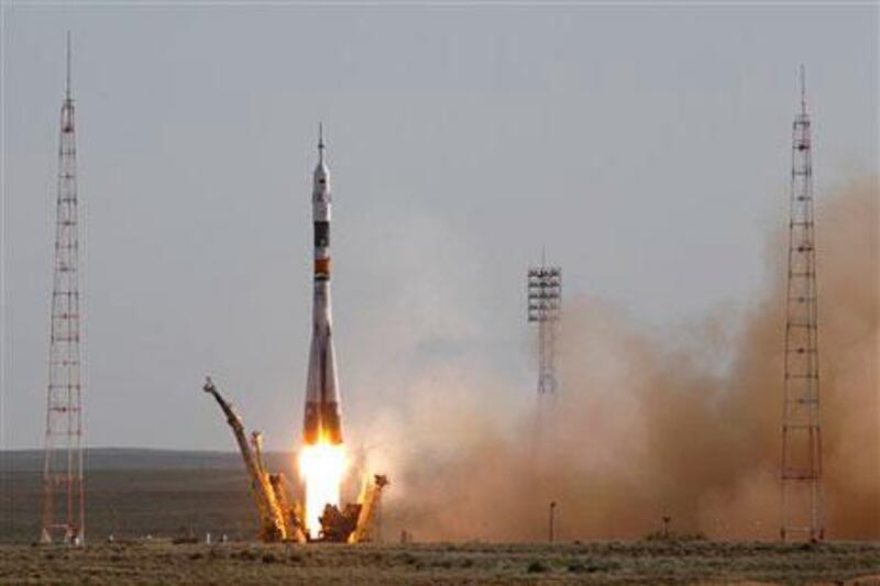 The Soyuz-FG rocket booster with a Soyuz TMA-04M spaceship carrying a new crew to the International Space Station, ISS, blasts off from the Russian leased Baikonur cosmodrome, in Kazakhstan. (AP Photo/Mikhail Metzel)