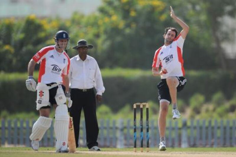 DUBAI, UNITED ARAB EMIRATES - JANUARY 06:  Graham Onions of England bowls watched by Andrew Strauss during a nets session at The ICC Global Academy on January 6, 2012 in Dubai, United Arab Emirates.  (Photo by Gareth Copley/Getty Images) *** Local Caption ***  136470972.jpg