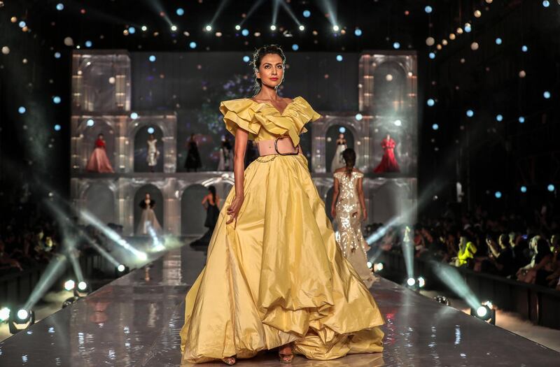 epa07793673 A model presents a creation by Indian designers Gauri and Nainika during the grand finale of Lakme Fashion Week (LFW) Winter/Festive 2019 in Mumbai, India, 25 August 2019. More than 75 designers were showcasing their collections at the event.  EPA/DIVYAKANT SOLANKI