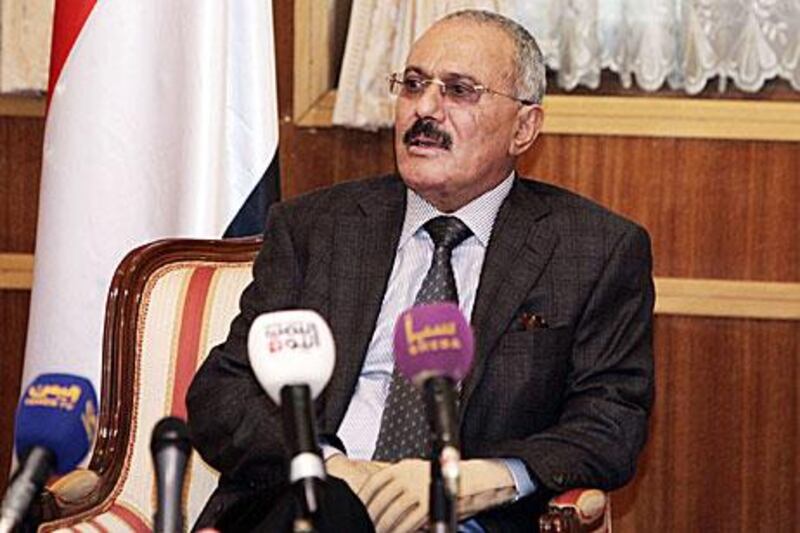 Ali Abdullah Saleh speaks to reporters in Sanaa yesterday.