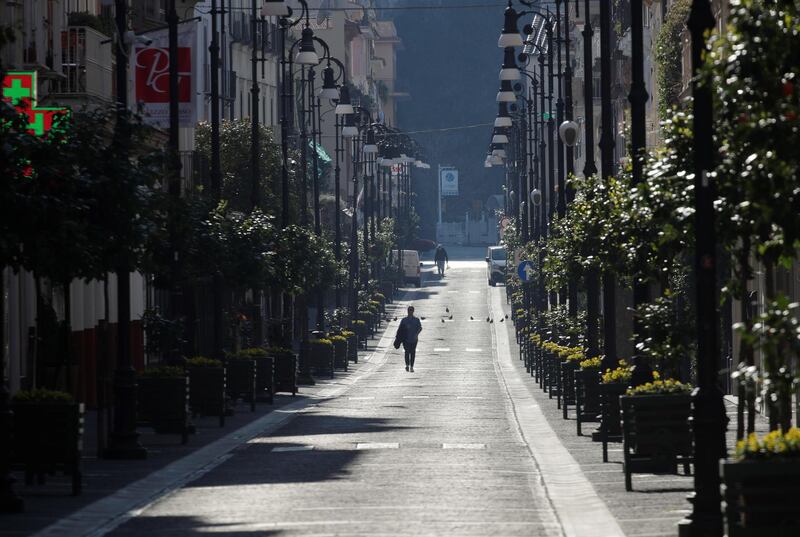 General view of a man in a street in Sorrento as Italy remains under a nationwide lockdown in a government decree that orders Italians to stay at home, in Sorrento, Italy, March 19, 2020. REUTERS/Ciro De Luca