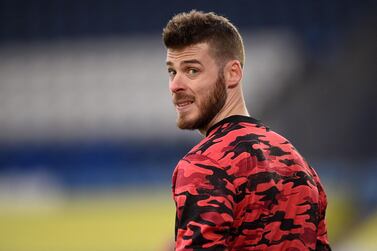 Manchester United's Spanish goalkeeper David de Gea warms up ahead of the English FA Cup quarter-final football match between Leicester City and Manchester United at King Power Stadium in Leicester, central England on March 21, 2021. RESTRICTED TO EDITORIAL USE. No use with unauthorized audio, video, data, fixture lists, club/league logos or 'live' services. Online in-match use limited to 120 images. An additional 40 images may be used in extra time. No video emulation. Social media in-match use limited to 120 images. An additional 40 images may be used in extra time. No use in betting publications, games or single club/league/player publications. / AFP / POOL / Oli SCARFF / RESTRICTED TO EDITORIAL USE. No use with unauthorized audio, video, data, fixture lists, club/league logos or 'live' services. Online in-match use limited to 120 images. An additional 40 images may be used in extra time. No video emulation. Social media in-match use limited to 120 images. An additional 40 images may be used in extra time. No use in betting publications, games or single club/league/player publications.