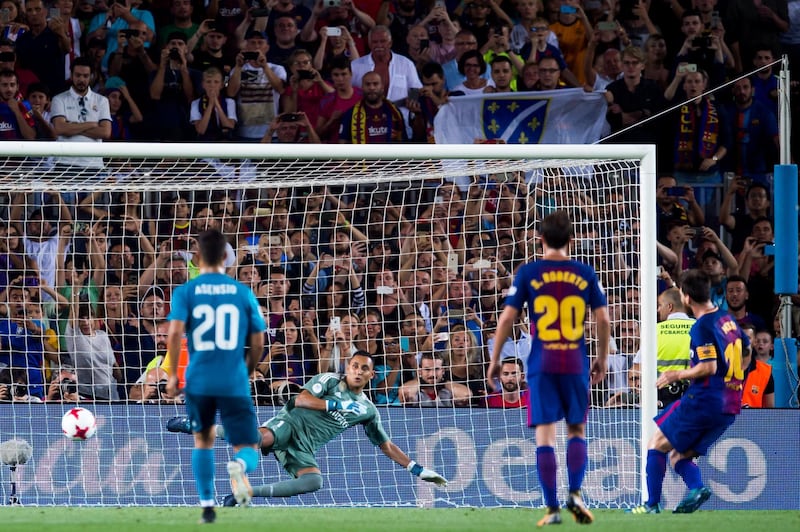 BARCELONA, SPAIN - AUGUST 13: Lionel Messi of FC Barcelona scores his team's first goal with a penalty kick during the Supercopa de Espana Supercopa Final 1st Leg match between FC Barcelona and Real Madrid at Camp Nou on August 13, 2017 in Barcelona, Spain. (Photo by Alex Caparros/Getty Images)