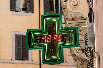 A sign shows the temperature in Rome. EPA