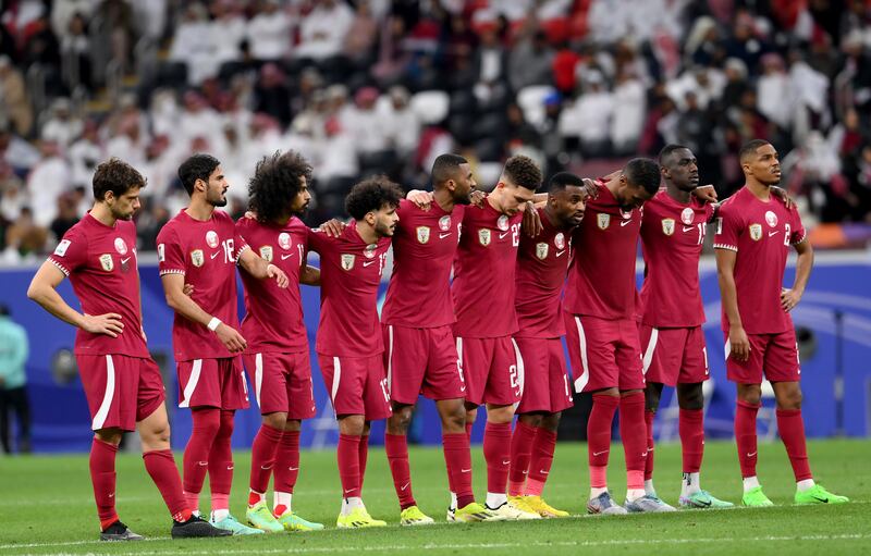 Qatar players line up during the penalty shoot out. Getty Images