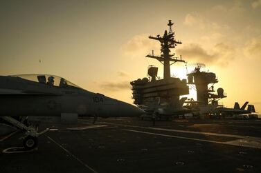 The sun setting behind the Nimitz-class aircraft carrier USS Abraham Lincoln (CVN 72), in the Arabian Sea. EPA