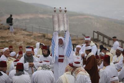 Members of the Samaritan community pray at sunrise while marking the end of Passover on top of Mount Gerizim, above the West Bank city of Nablus. EPA