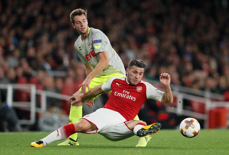 Cologne's Lukas Klunter vies for the ball with Arsenal's Sead Kolasinac. David Klein / Reuters
