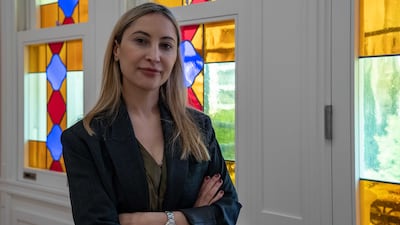 Sursock Museum director Karina El Helou in front of the recently restored stained glass windows in Beirut. Matt Kynaston / The National