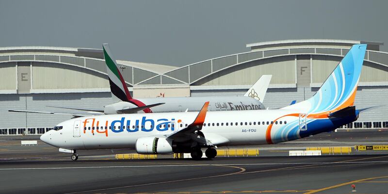epa05219500 A picture dated on 17 November 2011 shows an aircraft (Front) owned by Fly Dubai Airlines landing at Dubai International Airport during the Dubai Air Show in Gulf emirate of Dubai, United Arab Emirates. Fly Dubai Flight FZ981, from Dubai to Rostov-on-Don, crashed during its landing approach, at Rostov-on-Don Airport, Russia, on 19 March 2016. The Boeing-737 was carrying 55 passengers, four of whom were children, and 6 crew members, all of whom who died when the plane crashed some 50 to 100 meters left of the runway, according to airport authorities.  EPA/ALI HAIDER *** Local Caption *** 52656729
