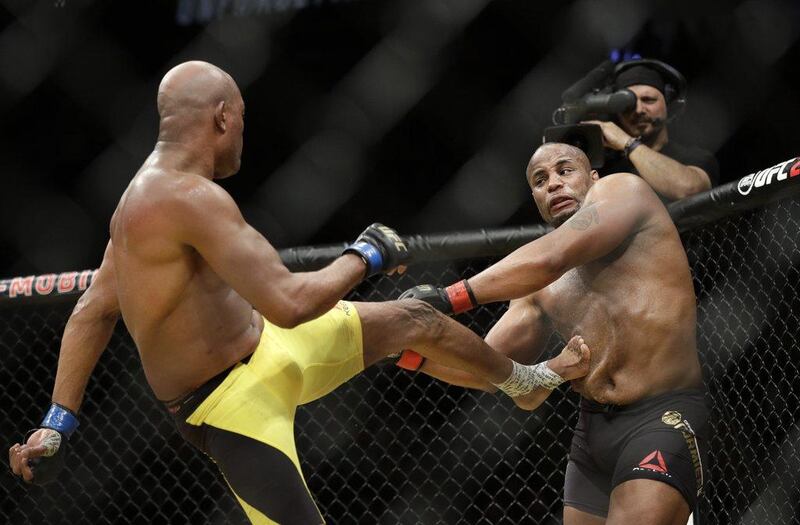 Anderson Silva kicks Daniel Cormier during their light heavyweight bout at UFC 200, Saturday, July 9, 2016, in Las Vegas. John Locher / AP Photo